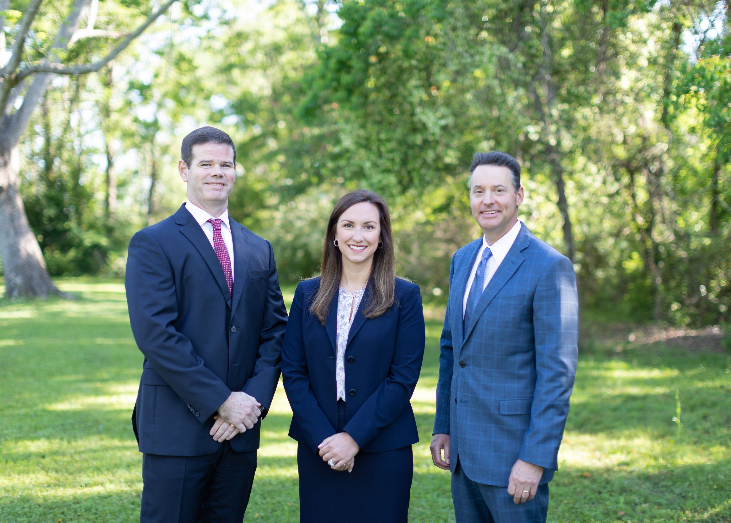 image of 3 attorneys standing outside