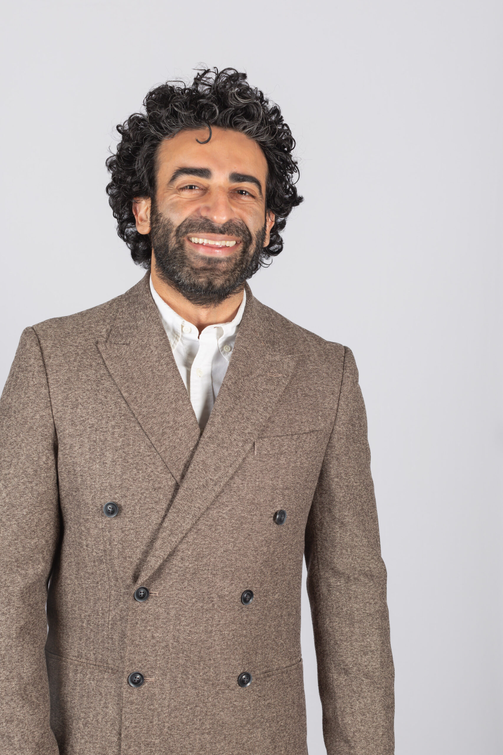 headshot of a man smiling