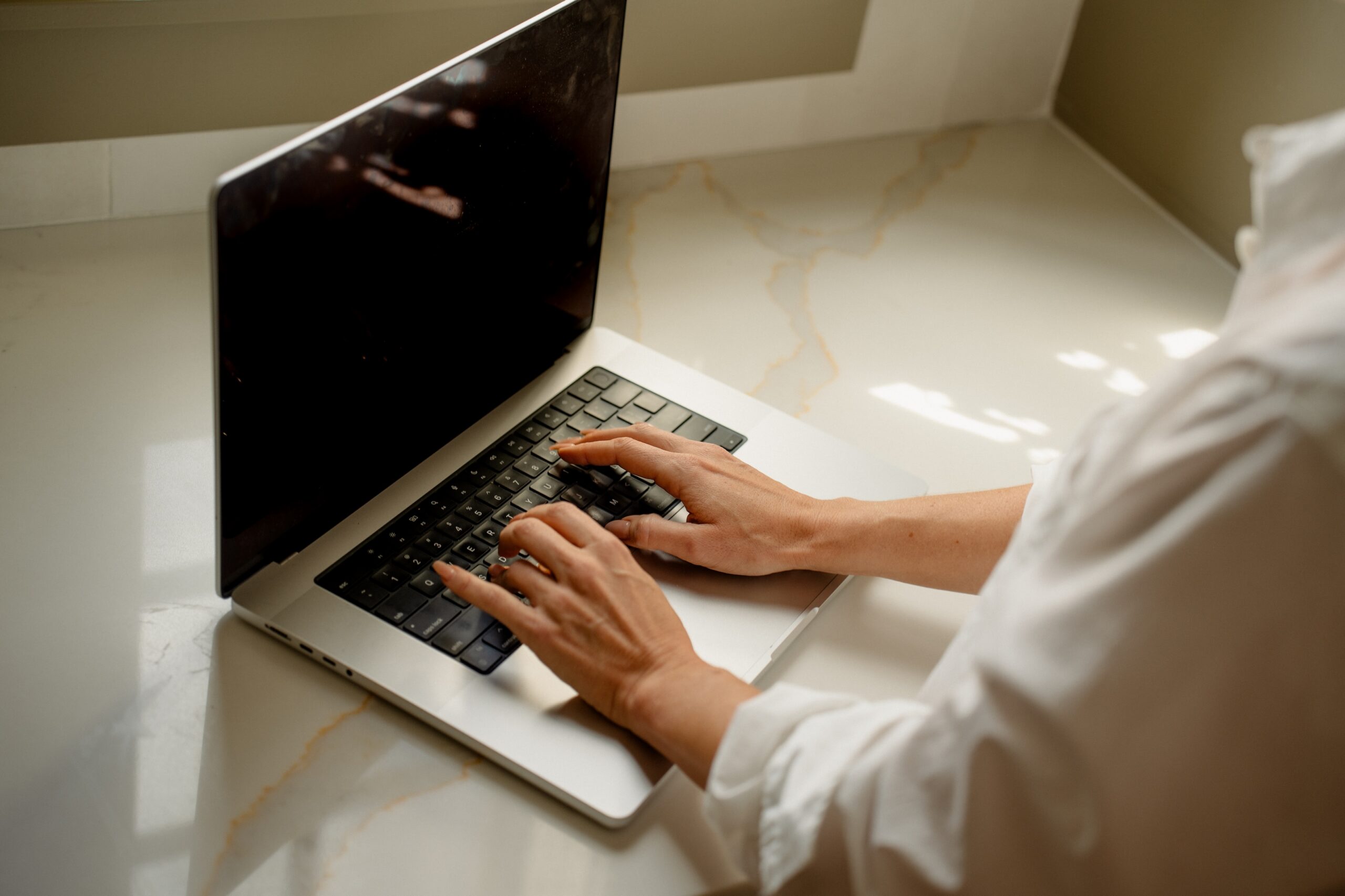 woman typing on a computer
